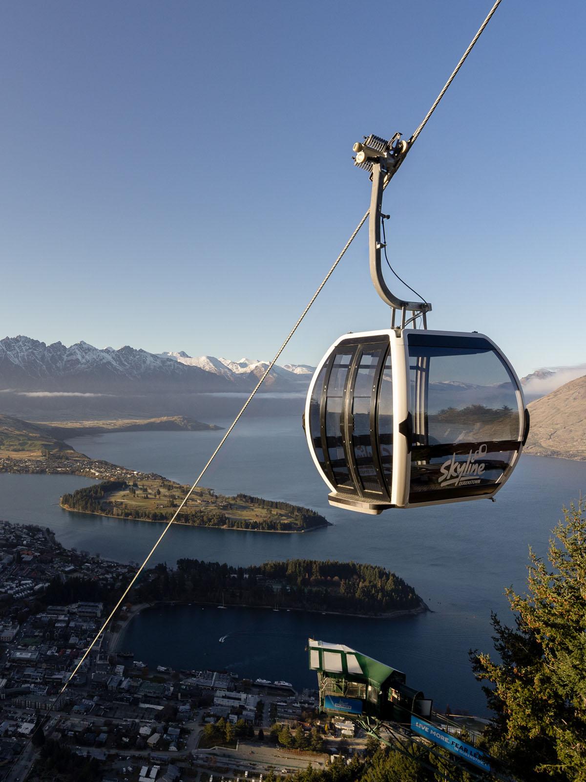 Image of Gondola going up the mountain with spectacular views of Queenstown