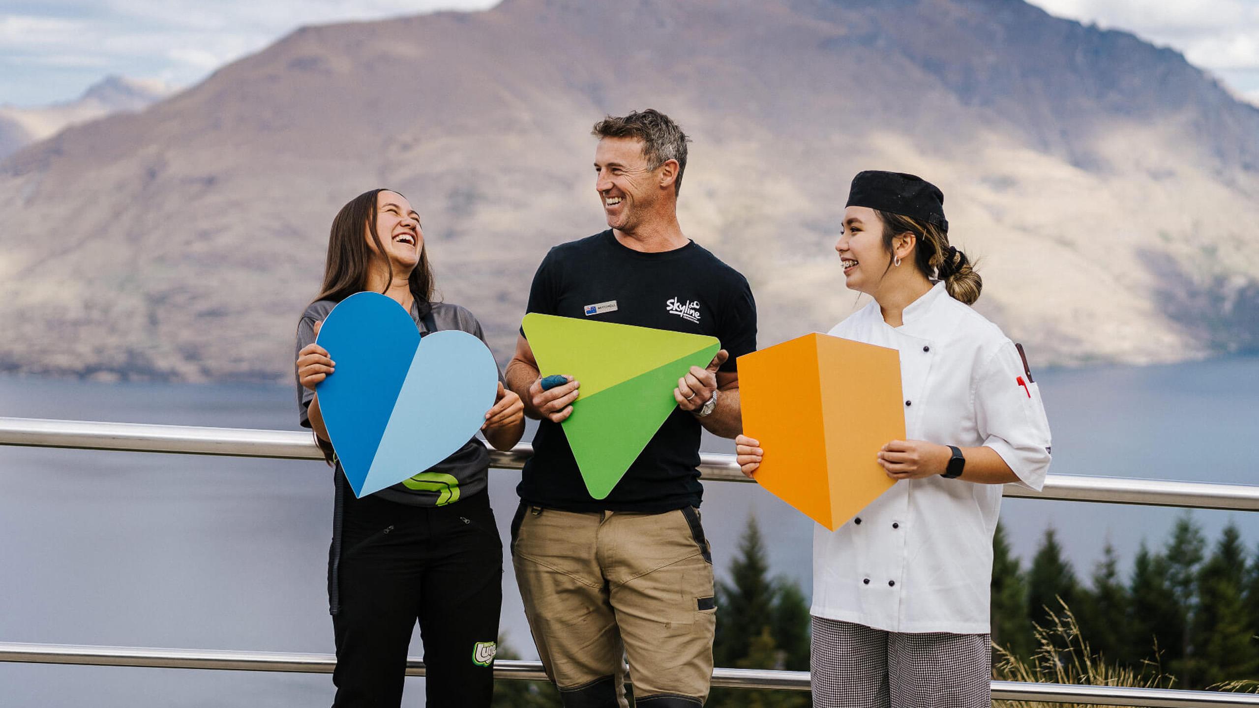 Image of three Skyline workers holding their brand values